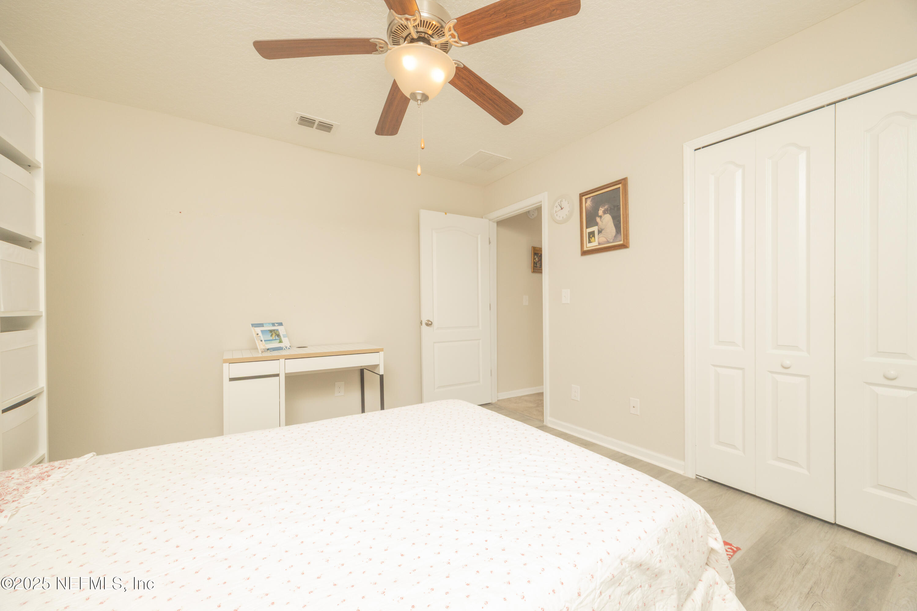 333 Old Hickory Forest Road St. Augustine, FL 32084 - Photo 33 of 62 a bedroom with a bed and a chandelier