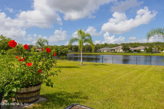 an aerial view of a house with a swimming pool
