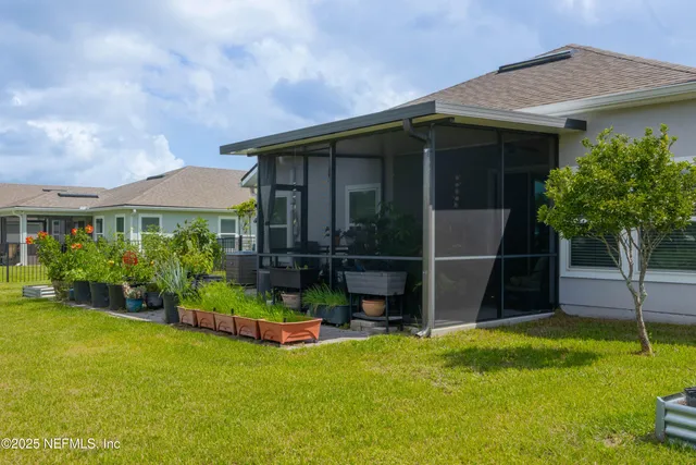 an aerial view of a house with a lake view