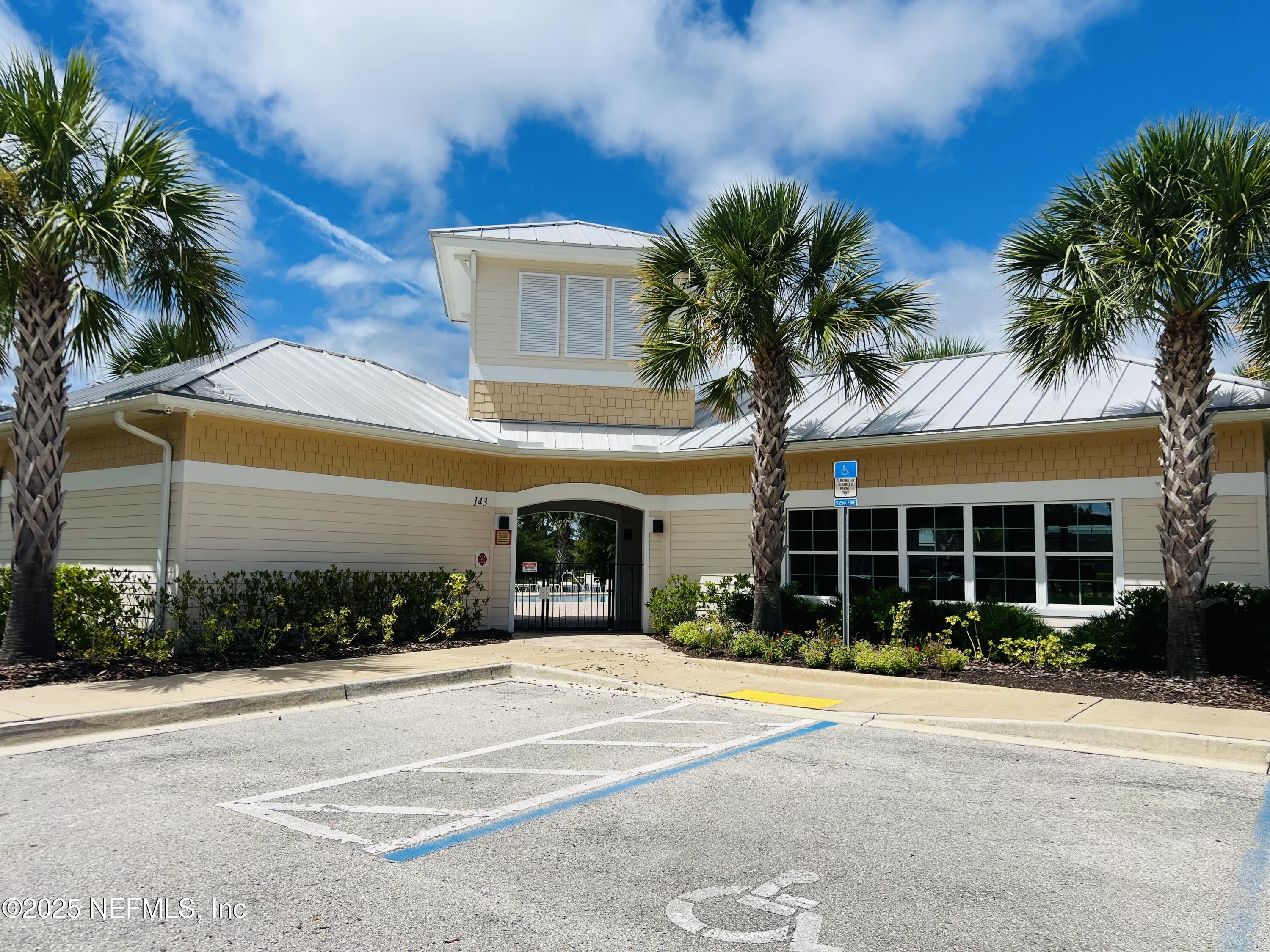 333 Old Hickory Forest Road St. Augustine, FL 32084 - Photo 56 of 62 a front view of a house with a yard and potted plants