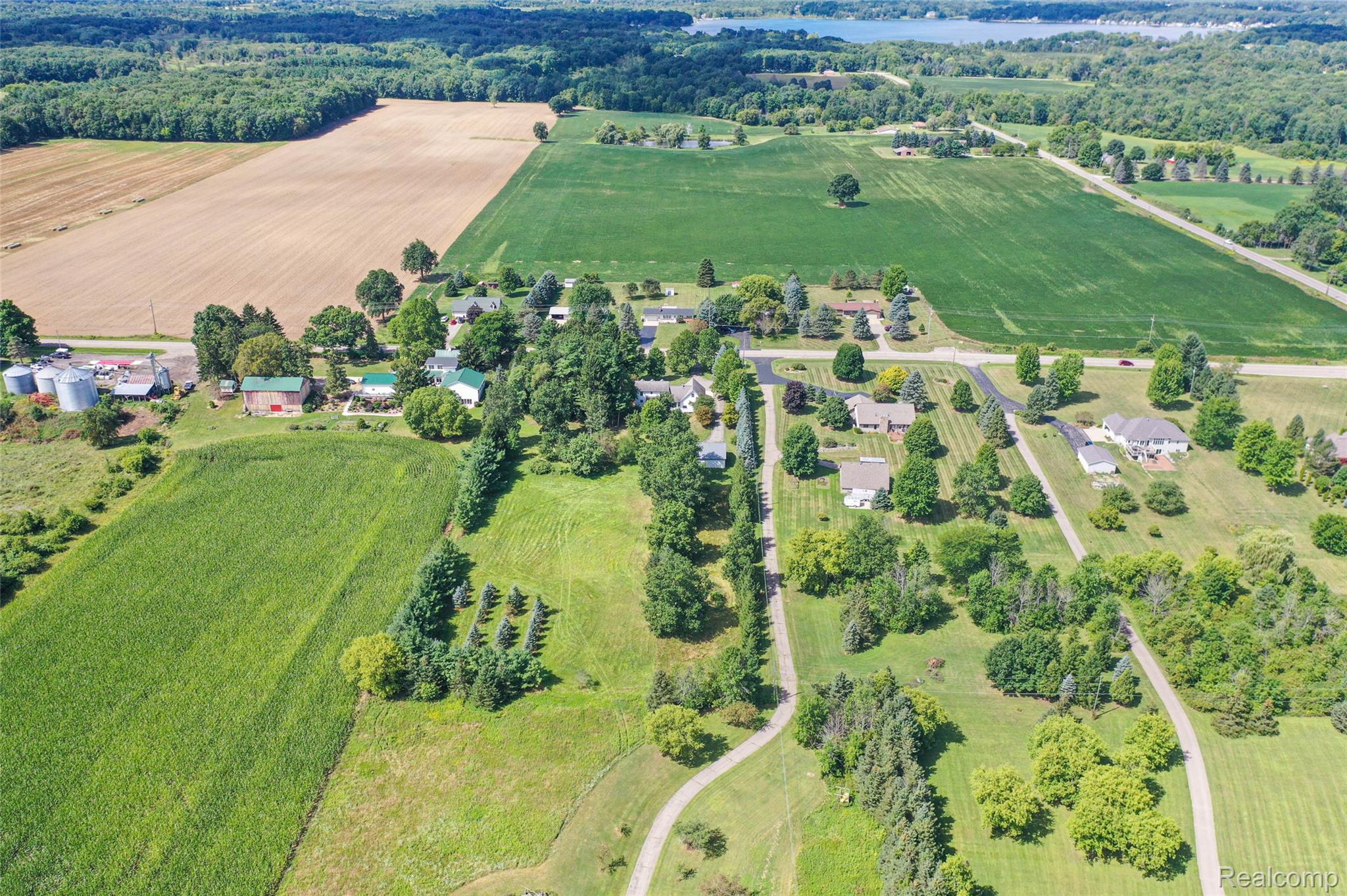 1591 Baldwin Road Lapeer, MI 48446 - Photo 46 of 46 Aerial view of sparsely populated area featuring a tree filled landscape