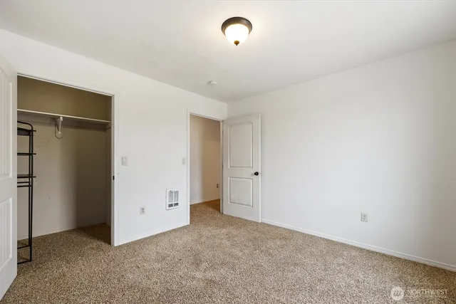 a view of a chair and table on the garden