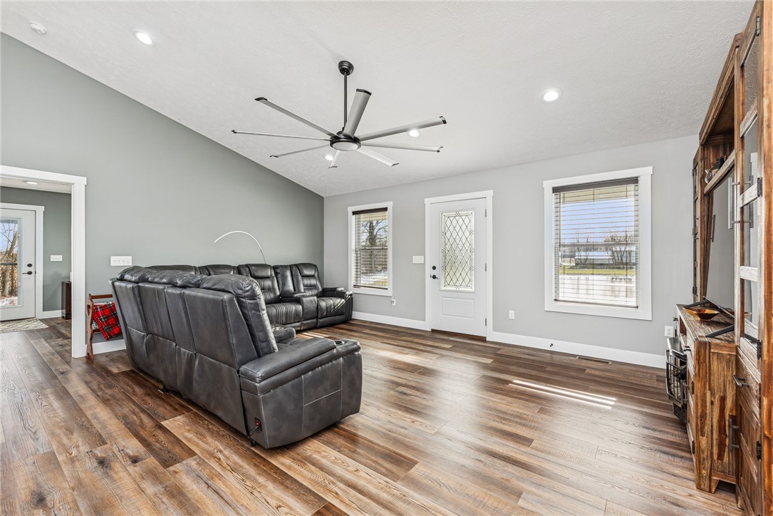 1602 Westboro Road Blanchester, OH 45107 - Photo 30 of 81 Bright and airy living area with rich wood flooring and a vaulted ceiling.