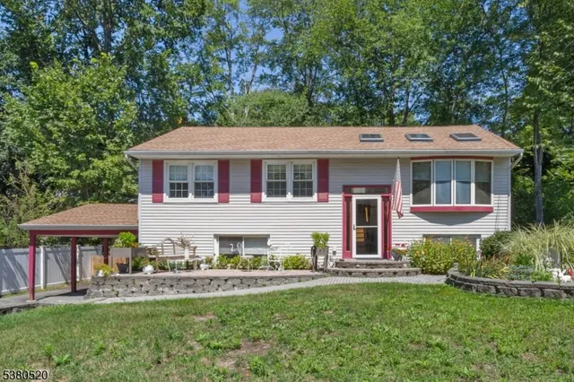 a front view of a house with a yard table and chairs
