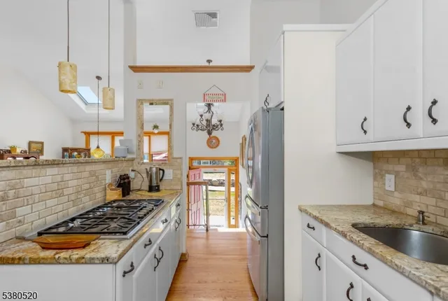 a kitchen with a stove and a refrigerator