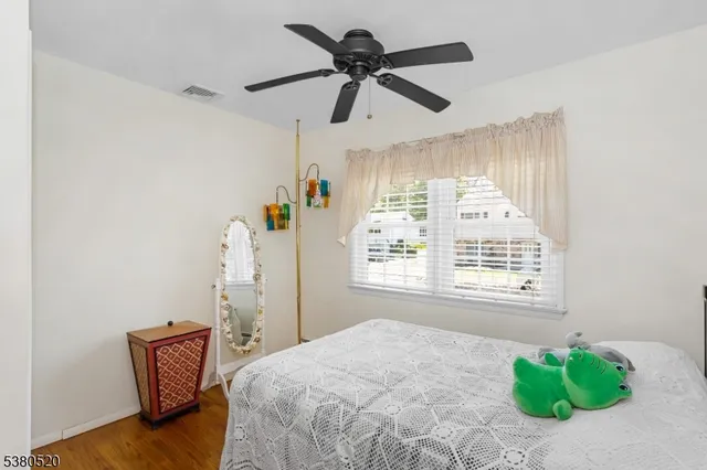 a bedroom with a bed and a chair