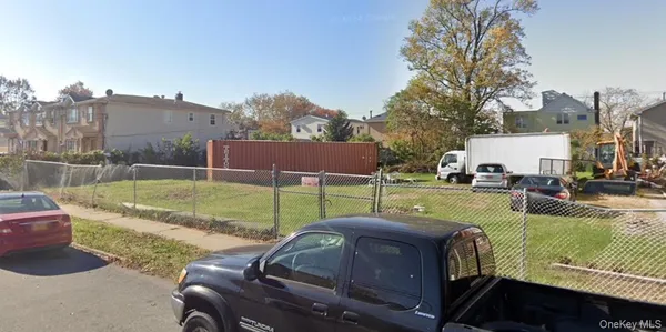 a view of a backyard with swimming pool