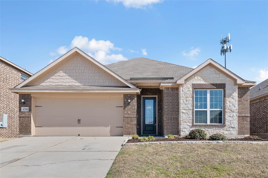 a front view of a house with a garage