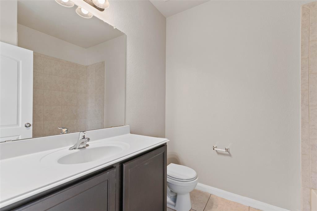 4700 Conley Lane Denton, TX 76207 - Photo 14 of 17 a bathroom with a sink and a toilet