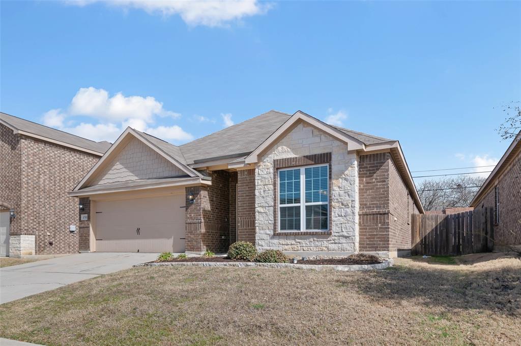 4700 Conley Lane Denton, TX 76207 - Photo 3 of 17 a front view of a house with a yard and garage