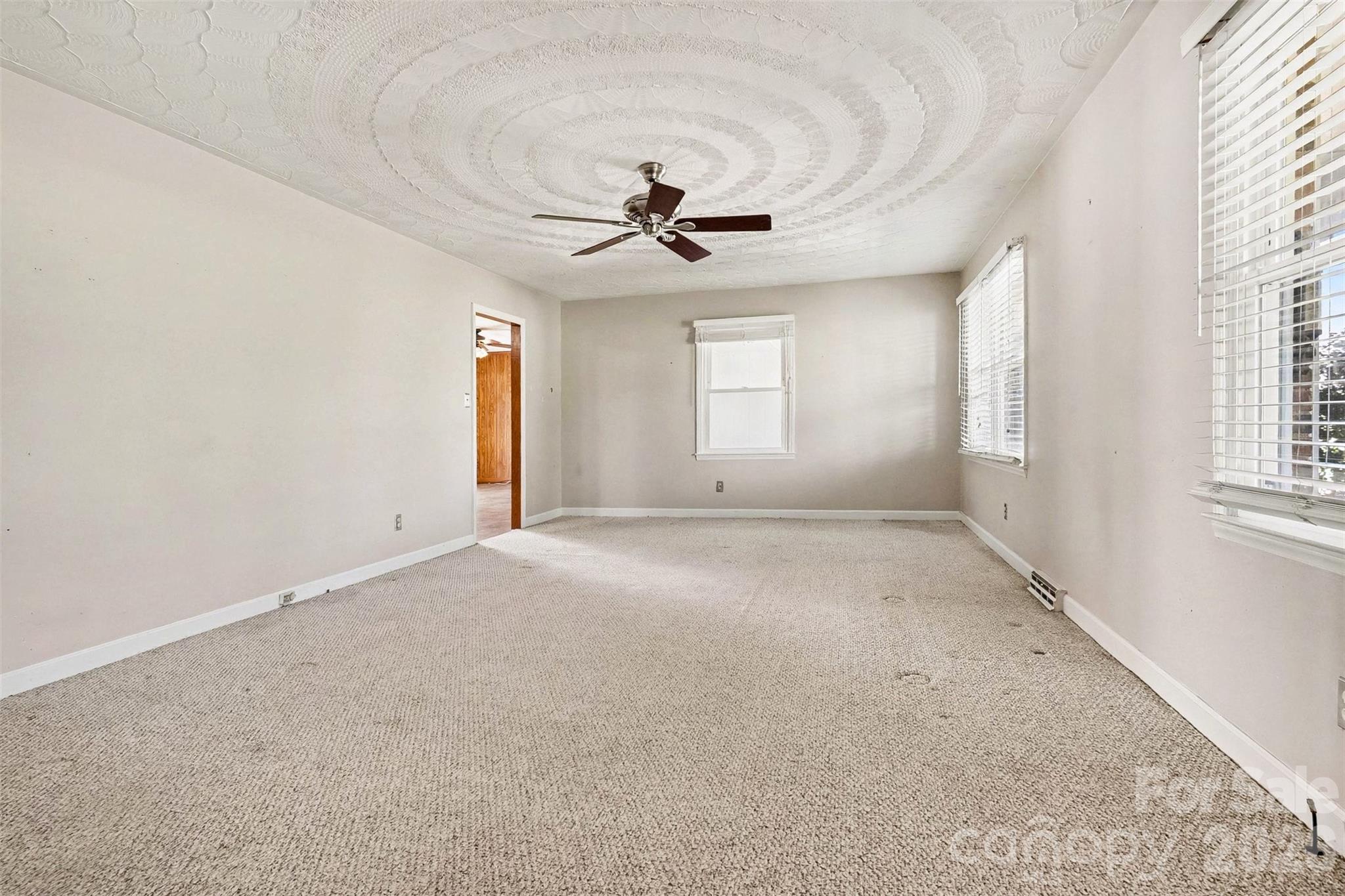 1388 Smith Farm Road Lincolnton, NC 28092 - Photo 11 of 19 an empty room with windows and fan