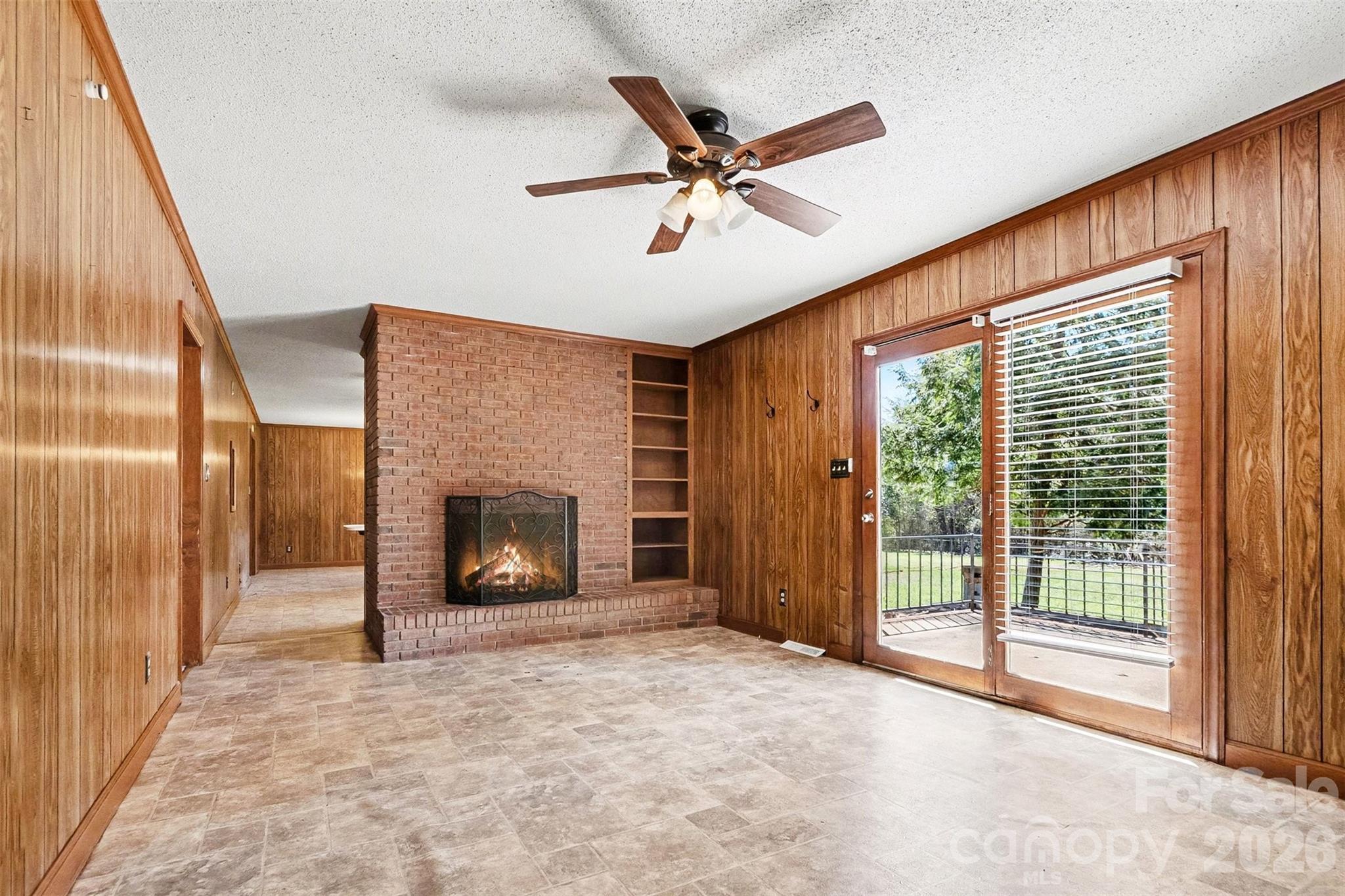 1388 Smith Farm Road Lincolnton, NC 28092 - Photo 3 of 19 a view of a livingroom with a fireplace and window