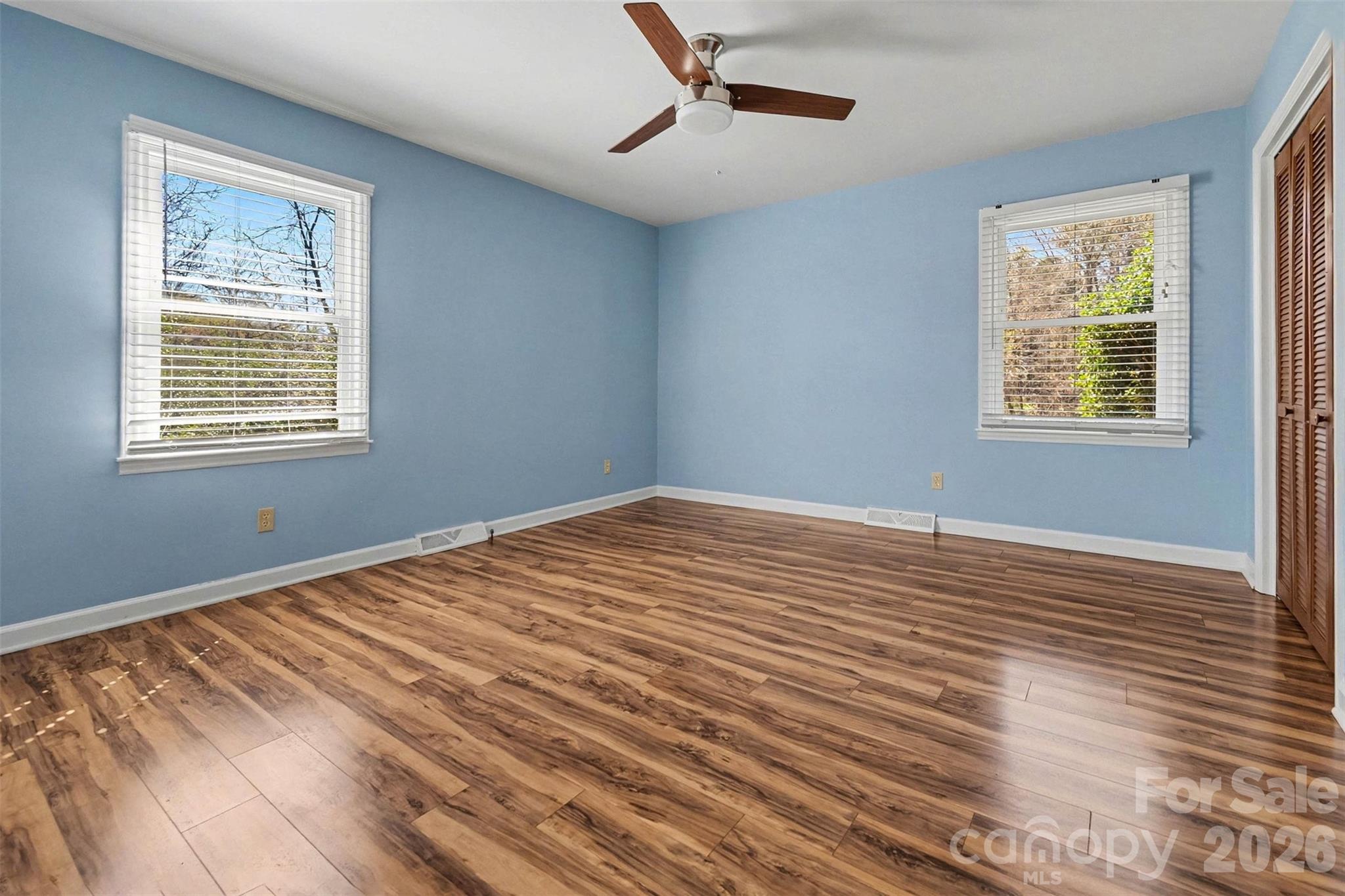 1388 Smith Farm Road Lincolnton, NC 28092 - Photo 4 of 19 a view of an empty room with wooden floor and a window