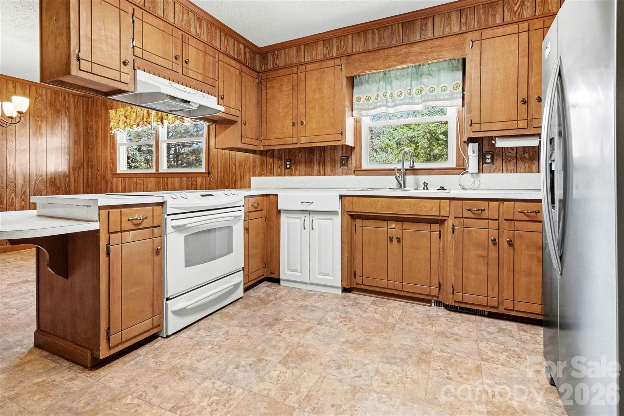 1388 Smith Farm Road Lincolnton, NC 28092 - Photo 7 of 19 a kitchen with a stove sink and cabinets