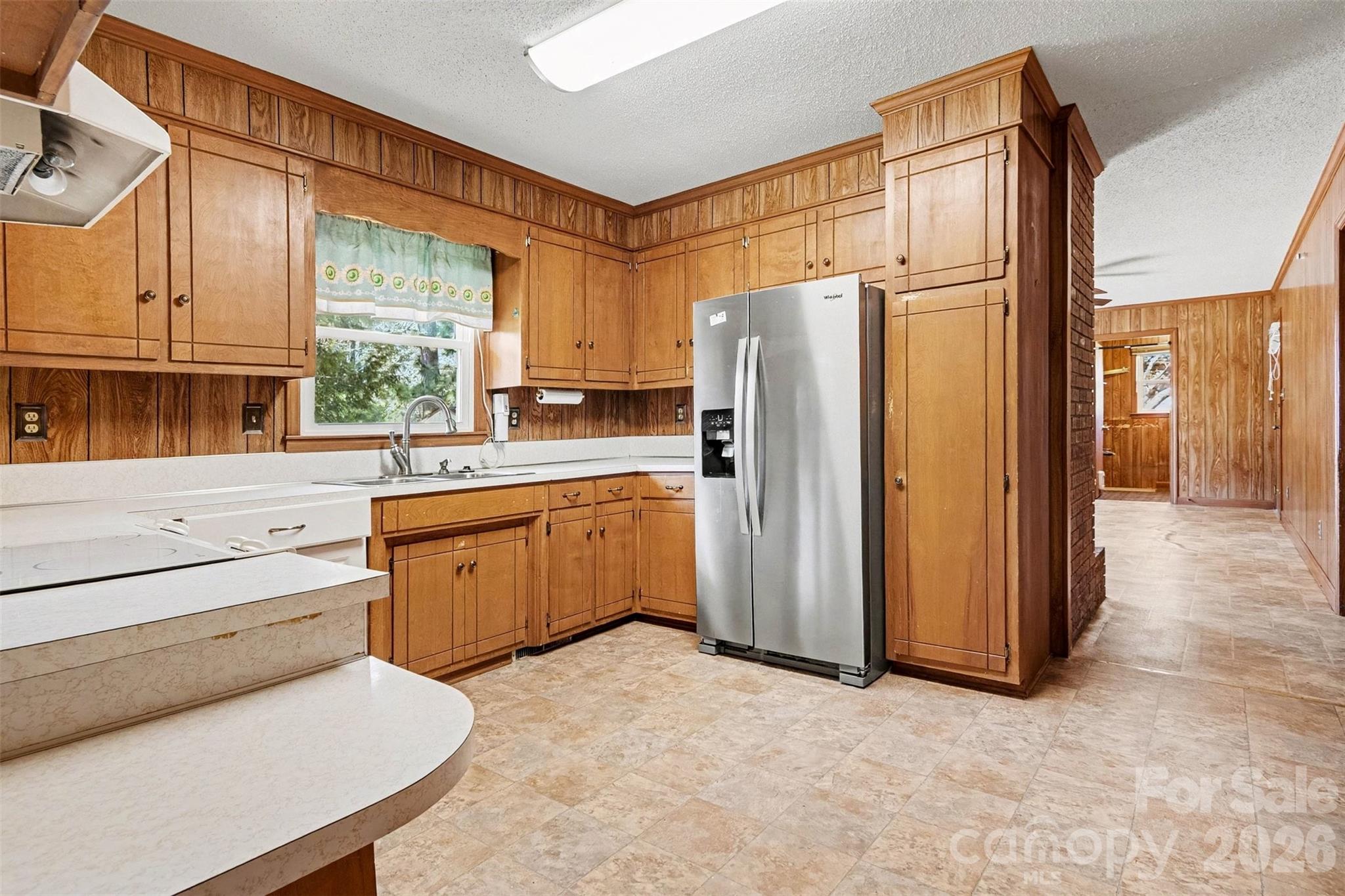 1388 Smith Farm Road Lincolnton, NC 28092 - Photo 8 of 19 a kitchen with a refrigerator sink and cabinets