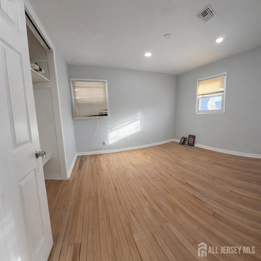 30 Falmouth Road Iselin, NJ 08830 - Photo 13 of 23 a view of empty room with wooden floor