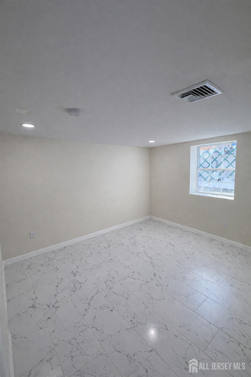 30 Falmouth Road Iselin, NJ 08830 - Photo 21 of 23 an empty room with windows