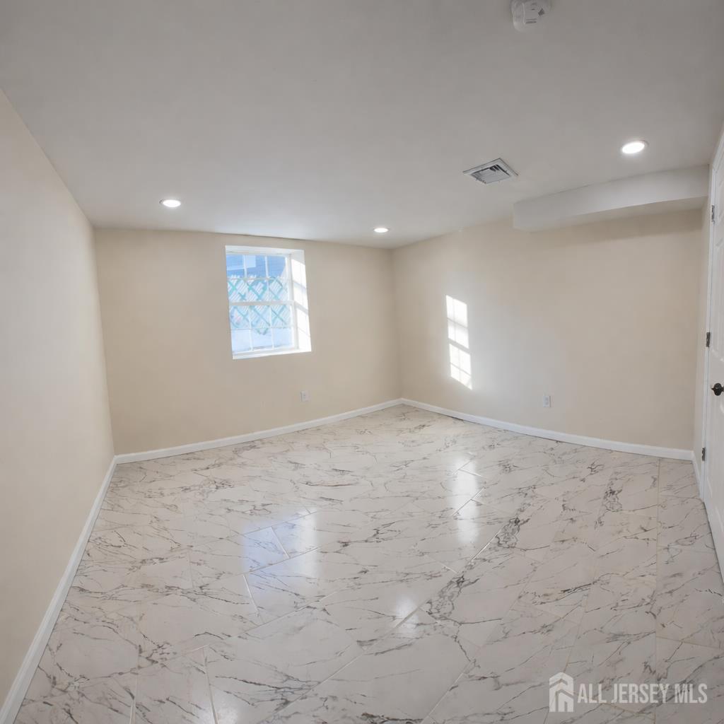30 Falmouth Road Iselin, NJ 08830 - Photo 22 of 23 an empty room with a window