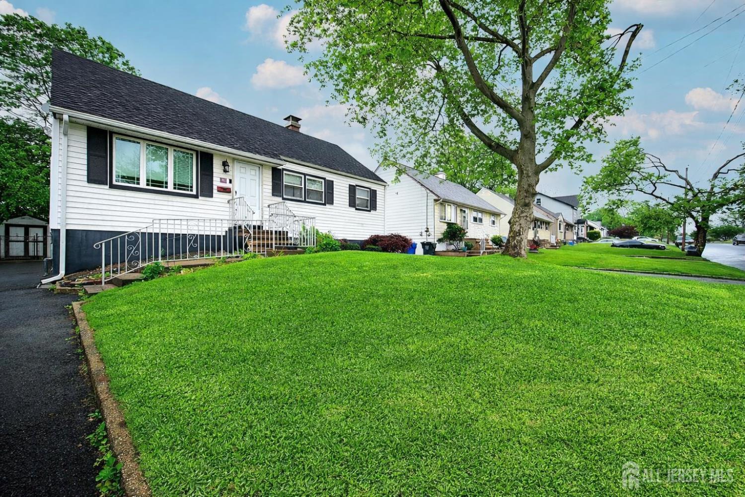 30 Falmouth Road Iselin, NJ 08830 - Photo 3 of 23 a front view of a house with a yard