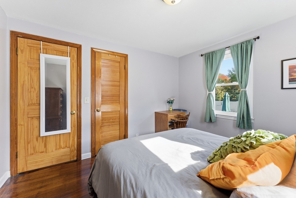 97 Robak Drive Chicopee, MA 01020 - Photo 27 of 41 a bedroom with a bed and wooden floor