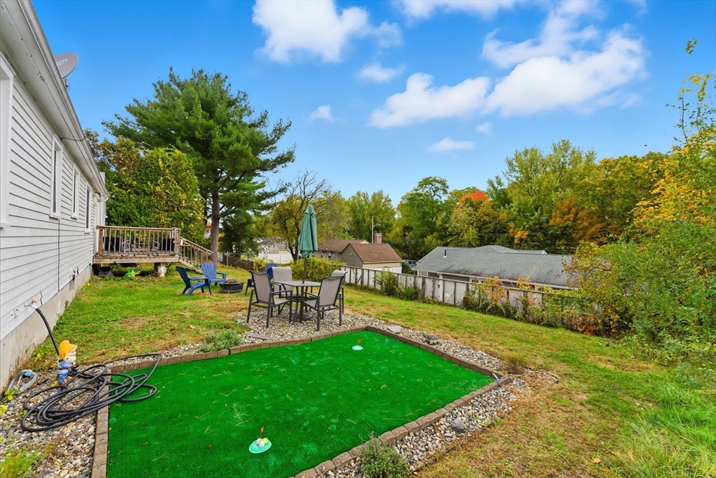 97 Robak Drive Chicopee, MA 01020 - Photo 34 of 41 a view of a garden with lawn chairs