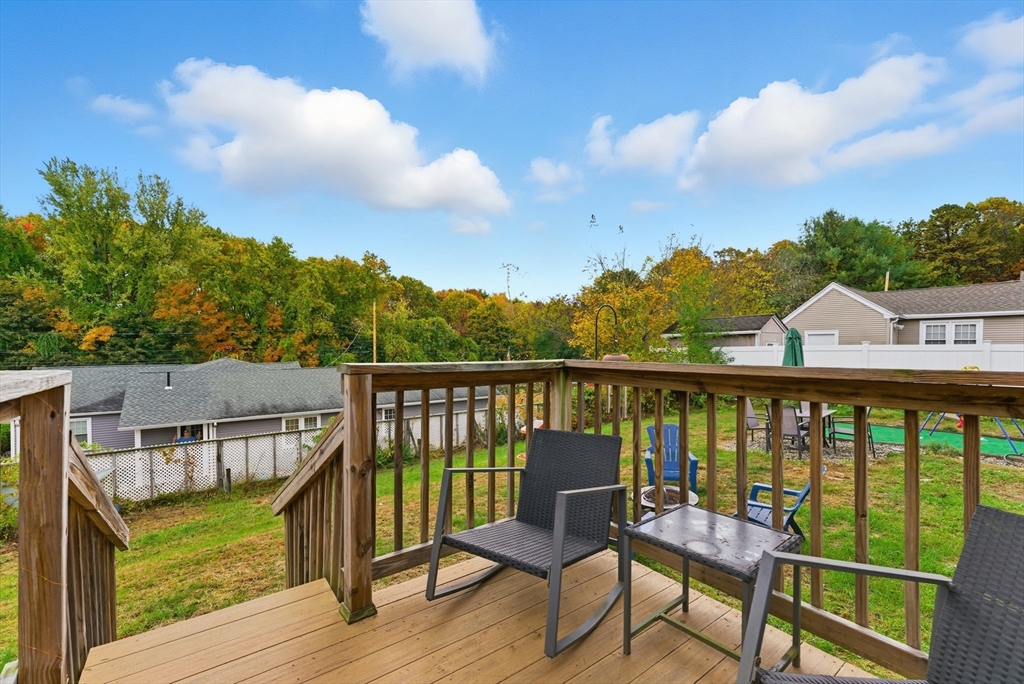 97 Robak Drive Chicopee, MA 01020 - Photo 36 of 41 a view of a balcony with wooden floor and outdoor seating