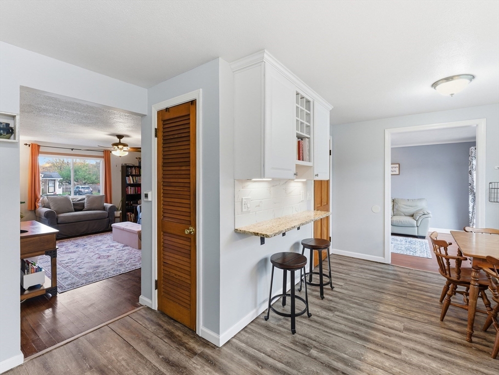 97 Robak Drive Chicopee, MA 01020 - Photo 9 of 41 a view of a dining room with furniture window and wooden floor