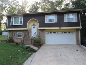 3760 Cedar Hurst Way Atlanta, GA 30349 - Photo 1 of 22 a front view of a house with garden