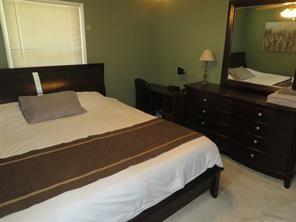 3760 Cedar Hurst Way Atlanta, GA 30349 - Photo 11 of 22 a bedroom with a bed and a closet