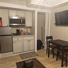 3760 Cedar Hurst Way Atlanta, GA 30349 - Photo 15 of 22 a kitchen with white cabinets and appliances