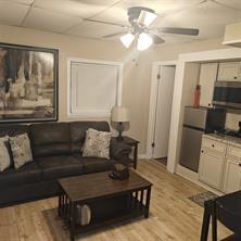3760 Cedar Hurst Way Atlanta, GA 30349 - Photo 16 of 22 a living room with furniture and a flat screen tv
