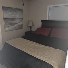 3760 Cedar Hurst Way Atlanta, GA 30349 - Photo 18 of 22 a bedroom with a bed and a window