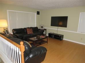 3760 Cedar Hurst Way Atlanta, GA 30349 - Photo 4 of 22 a living room with furniture and a flat screen tv