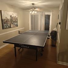 3760 Cedar Hurst Way Atlanta, GA 30349 - Photo 5 of 22 a room with a table chairs and wooden floor