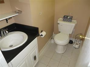 3760 Cedar Hurst Way Atlanta, GA 30349 - Photo 9 of 22 a bathroom with a sink and a toilet