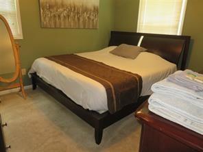 3760 Cedar Hurst Way Atlanta, GA 30349 - Photo 10 of 22 a bedroom with bed and window