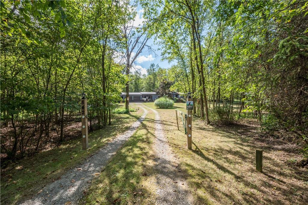 842 King Road Bulger, PA 15019 - Photo 9 of 12 a view of a backyard with table and chairs and a large tree