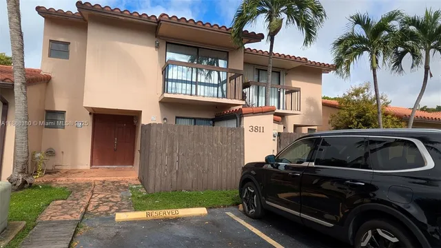 a view of a car park in front of house