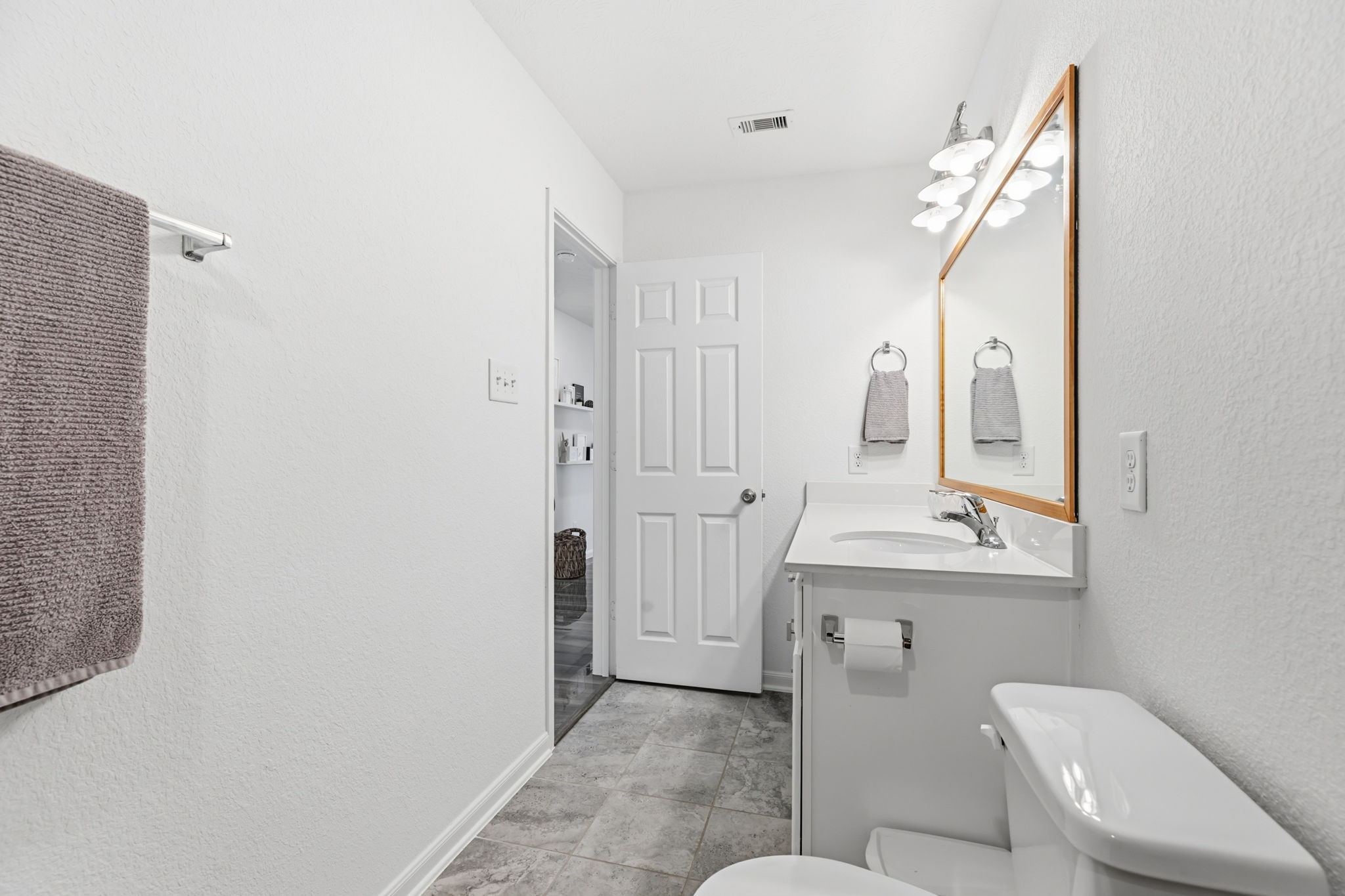 5127 Avondale Rise Street Katy, TX 77493 - Photo 37 of 47 a bathroom with a toilet a sink and mirror
