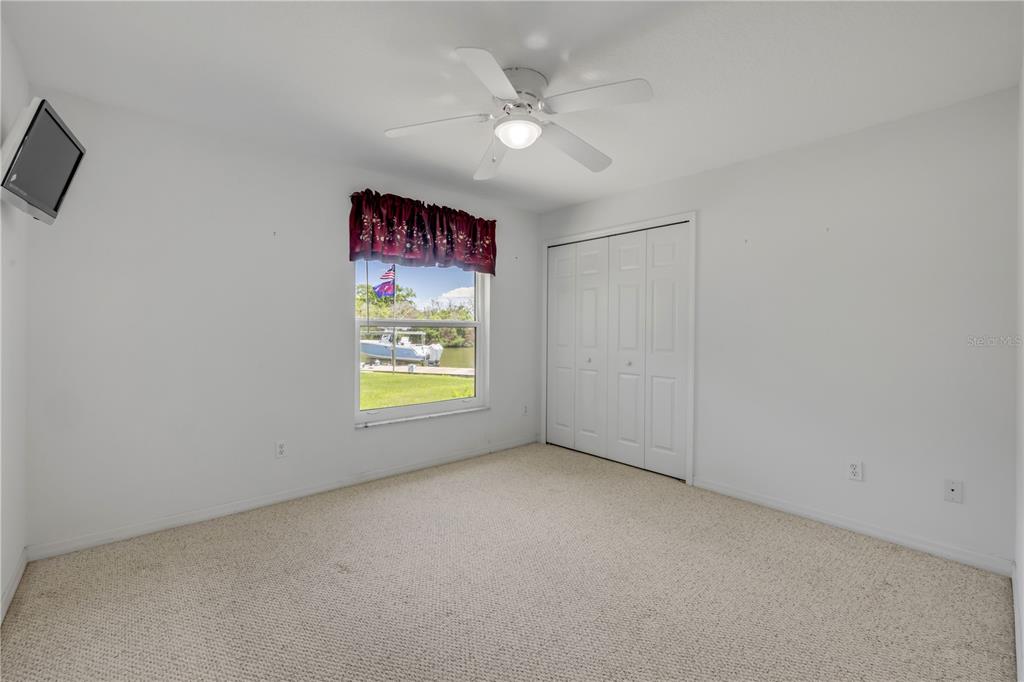 192 Azalea Road Edgewater, FL 32141 - Photo 30 of 94 an empty room with windows and fan
