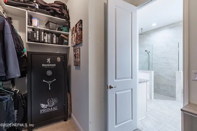 a living room with a bed furniture and a window