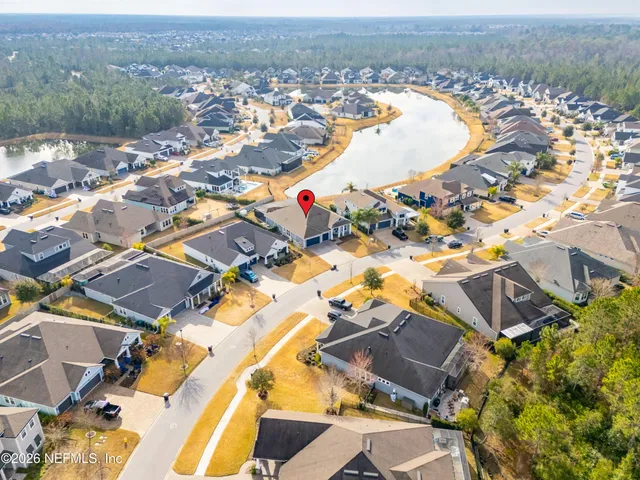 an aerial view of a house with swimming pool