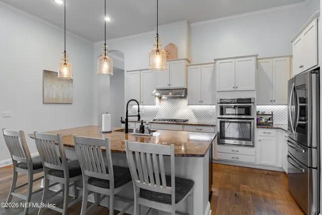 a room with book shelf and a window