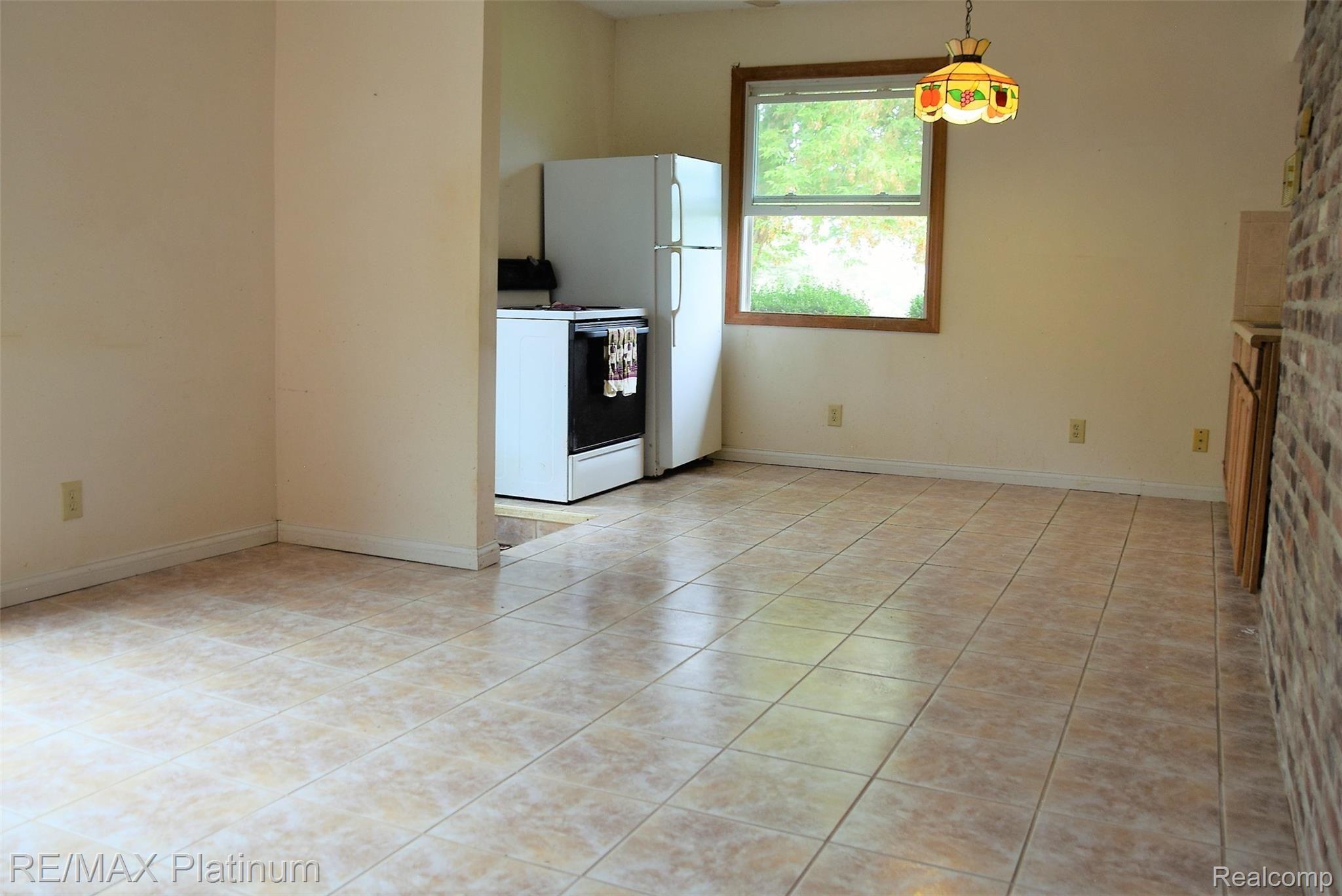 7525 Fisher Road Howell, MI 48855 - Photo 30 of 54 guest kitchen frig stove.JPG