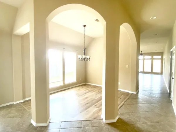 a view of a bathroom with a tub shower and a sink