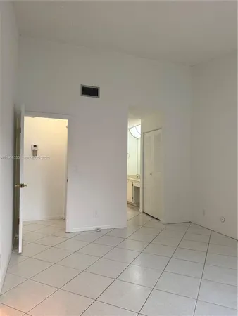 an empty room with a bathroom