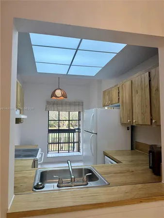 a view of a living room with a window