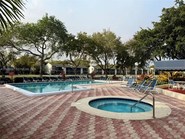 a view of a swimming pool with a sitting area