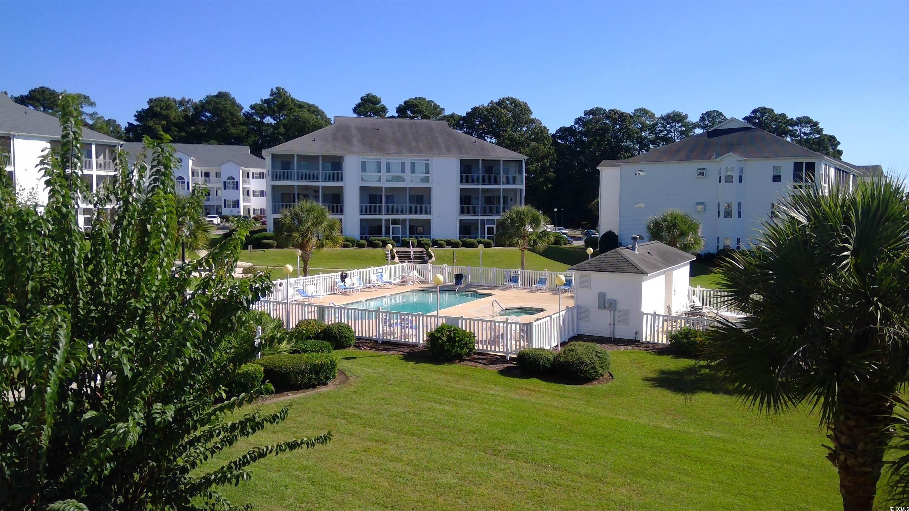 1512 Lanterns Rest Road, Unit 201 Myrtle Beach, SC 29579 - Photo 23 of 23 Drone / aerial view of a pool area