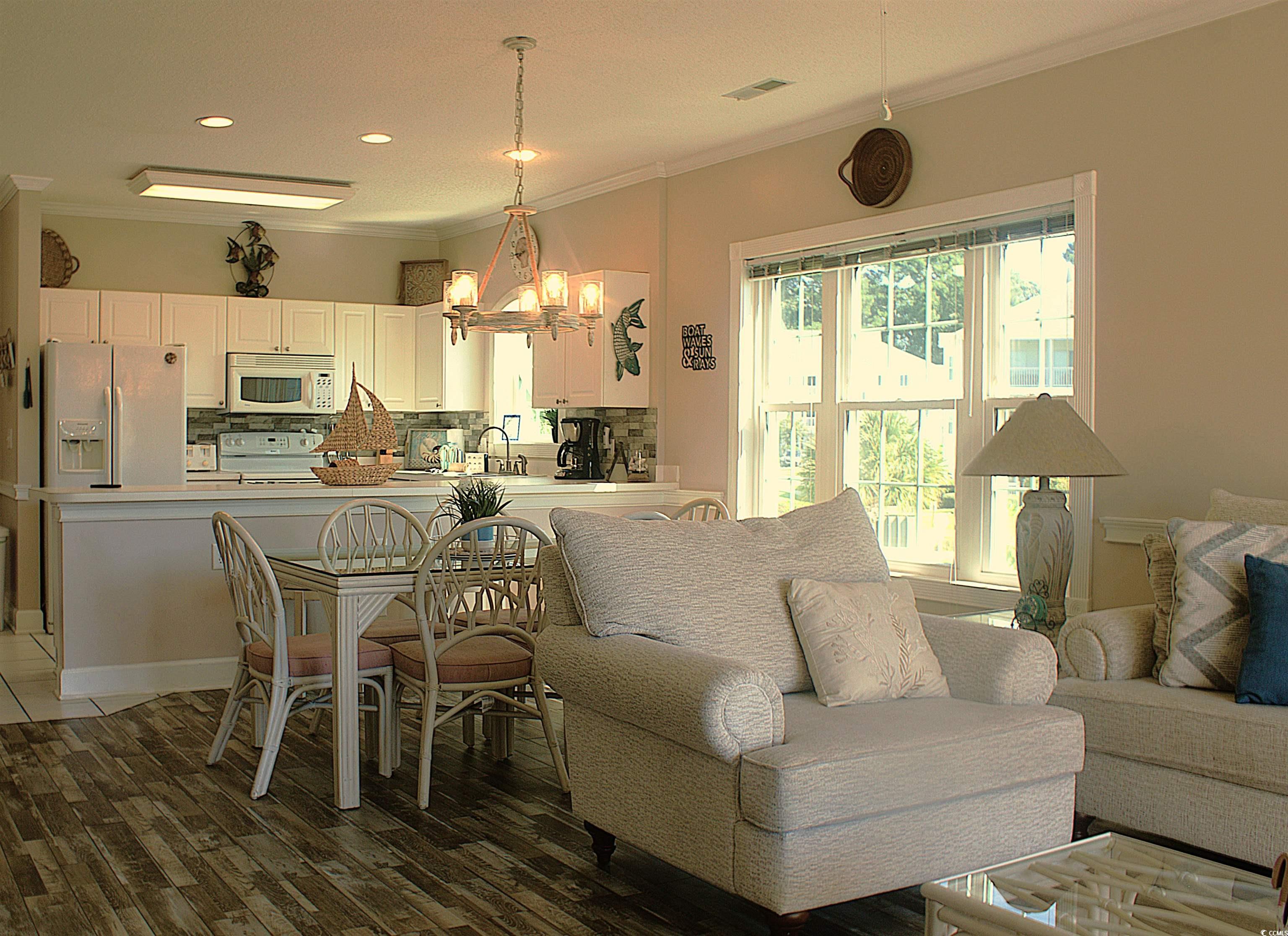 1512 Lanterns Rest Road, Unit 201 Myrtle Beach, SC 29579 - Photo 6 of 23 Living area with crown molding, a chandelier, light wood-type flooring, and recessed lighting